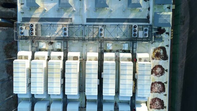 Top down aerial view of large scale data center, ATOS quantum AI computing, cloud storage and technology campus, cooling fans and turbines near Birmingham, United Kingdom