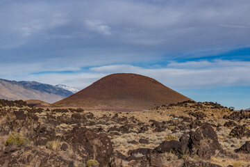 Volcanic rock, Basalt flows. Fossil Falls Trail, Coso Volcanic Field, Inyo County, California.  Coso Range, Basin and Range Province.  Red Hill (cinder cone or scoria cone). 