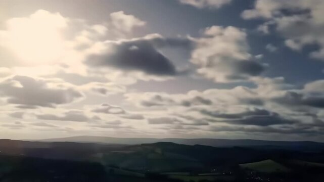 Dramatic Sky Over Rolling Hills at Sunset.