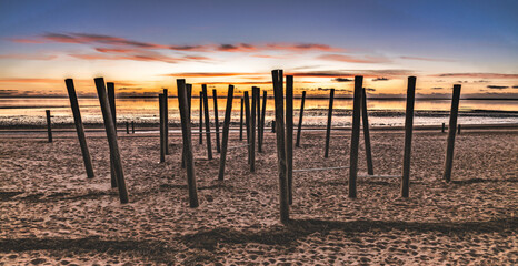 Tranquil Sunset Beach With Silhouette Walker Along Calm Shoreline At Dusk, Hjerting, Esbjerg, Denmark