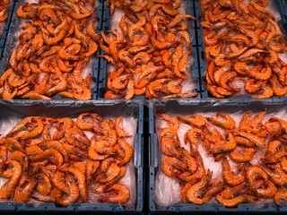 A stunning display of delicious shrimp on ice, ideal for seafood dishes and raw bars for any...