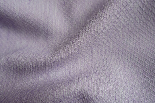 Folded light violet textured viscose pique fabric