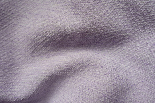 Pale light violet textured viscose pique fabric in soft folds