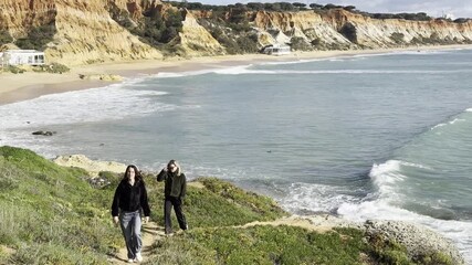 View of the sea and rocks of the beach of Olhos de Agua, Albufeira, Algarve, Portugal.