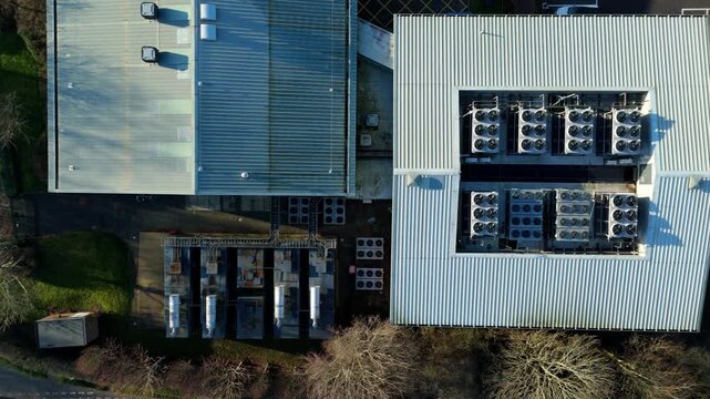 Top down aerial view of Critical data center infrastructure, HVAC fans and cooling units on roof for Quantum computing cloud storage IT services, futuristic server air cooled in Redditch, UK