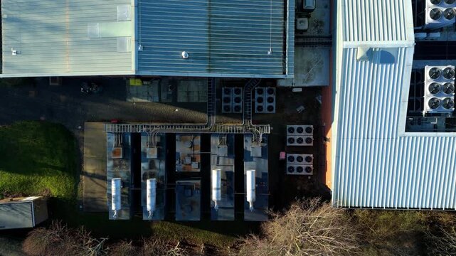 Top down aerial view of Critical data center infrastructure, HVAC fans and cooling units on roof for Quantum computing cloud storage IT services, futuristic server air cooled in Redditch, UK