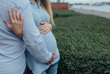 Pregnant Couple Embracing Outdoors, Expecting Baby