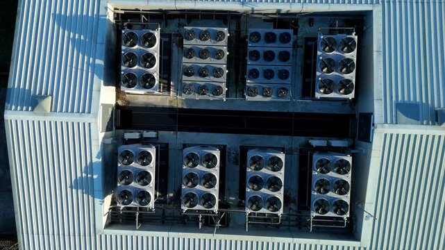 Top down aerial view of Critical data center infrastructure, HVAC fans and cooling units on roof for Quantum computing cloud storage IT services, futuristic server air cooled in Redditch, UK