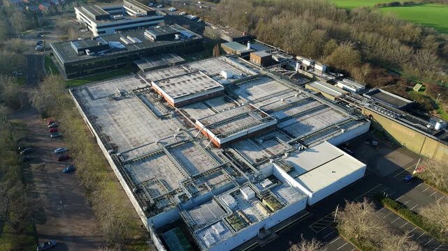 Aerial drone view of large scale data center, IT cloud storage and quantum computing critical infrastructure in Milton Keynes, United Kingdom. 