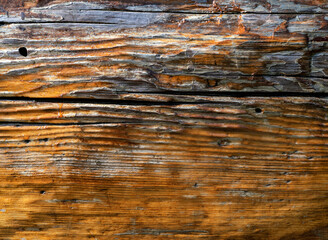 Abstract weathered wood background with traces of peeling varnish. Space for your design.