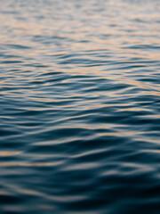 Water surface close-up view under the warm sunlight.