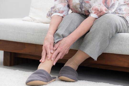 An image of ankle pain and joint pain in the elderly,without face