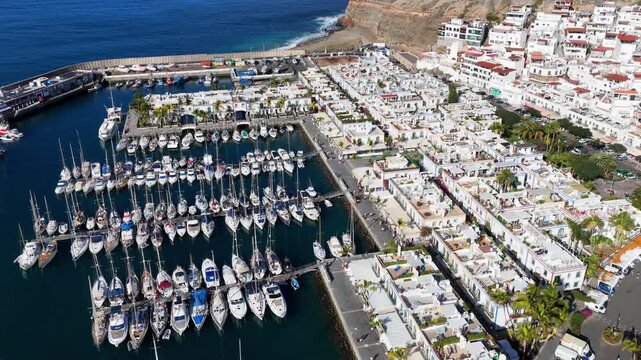 Puerto de Mog&aacute;n Marina and Little Venice White Village, Gran Canaria, Canary Islands - 4K Cinematic Aerial
