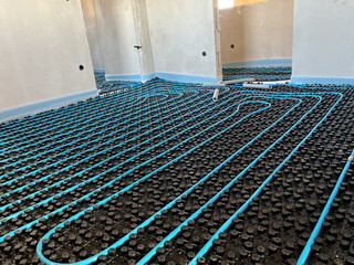 Modern under floor heating system installation in a new residential house. 