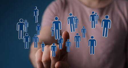 Hand interacting with digital human icons, symbolizing teamwork, networking and future connection...