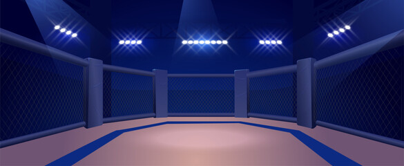An empty MMA sports ring with a fenced arena and floodlights. © sabelskaya