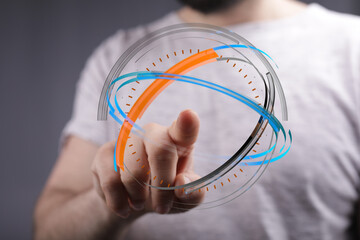 A person's finger pointing towards a digital sphere, symbolizing technology, innovation, and connection in a modern, futuristic conte