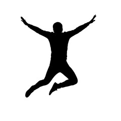 Silhouette of a man jumping with arms outstretched in joy.