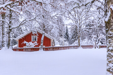 red house in snow