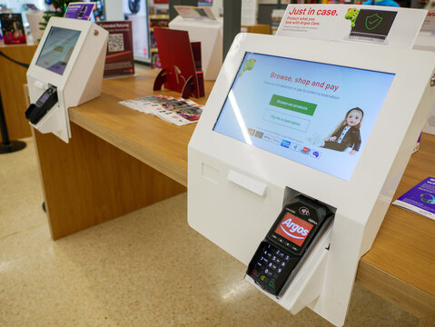 England, UK - October 3, 2025: Argos shopping and payment terminal display screen inside a store