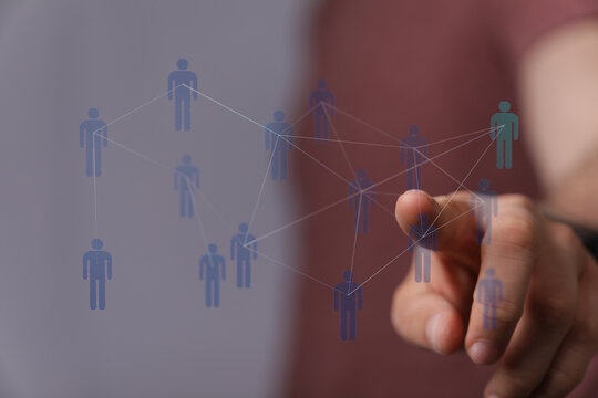 Hand touching network of people, concept of connectivity, community, and digital teamwork. Innovation, cooperat - Powered by Adobe