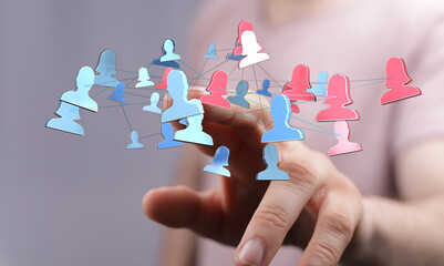 Concept of virtual network, social media, connection. Hand touching icons symbolizing people in a digital network. Collaboration and communicati