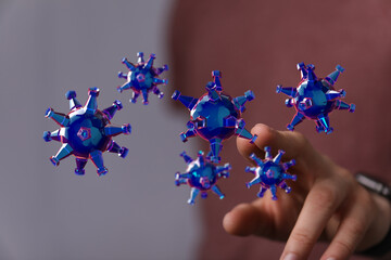 3D render illustration showing abstract coronavirus cells floating near a hand. Illustrating the...