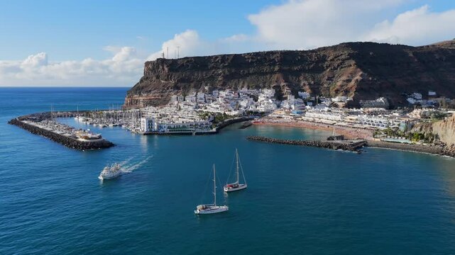 Puerto de Mog&aacute;n Marina and White Village at Sunset, Gran Canaria, Canary Islands - 4K Aerial View
