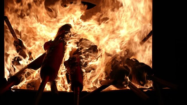 Dragon incense stick is burnt.. There are several red objects in the fire. The fire is very hot