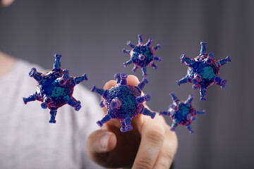 Artistic depiction of viruses, suggesting healthcare, disease, and medical concepts. Metaphor of holding and m