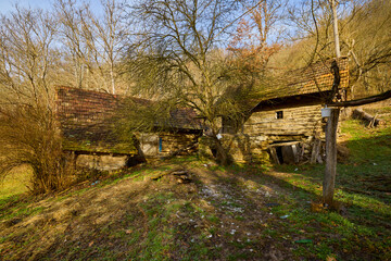 landscape with old wooden houses in the mountains in the Banat area of ​​Romania