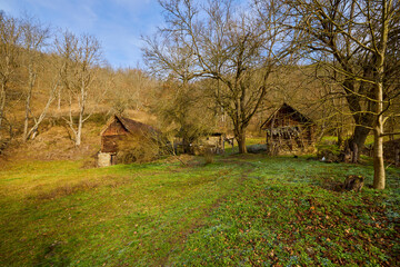 landscape with old wooden houses in the mountains in the Banat area of ​​Romania