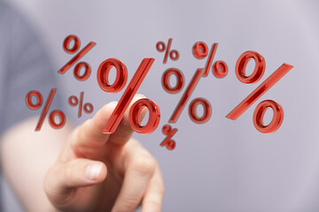 Hand interacting with floating percentage symbols, concept for discounts, interest, or financial gains. Perfect for business presentations and m