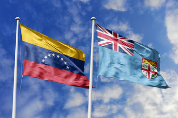 Venezuela and Fiji two flags textile cloth, fabric texture, union, peace, conflict and partnership concept. Venezuelan and Fijian official national relationship symbols.