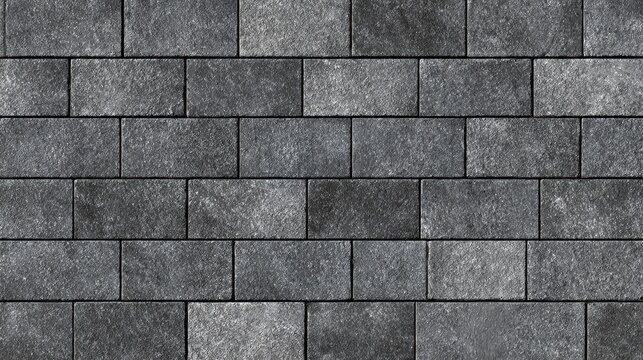 Rough textured dark grey block wall creating a simple masonry background, offering a durable surface pattern for exterior design, construction, and architectural backdrops
