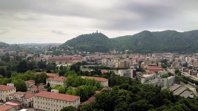 Title Drone flight towards Como city - Baradello Tower and mountain landscape in Italy