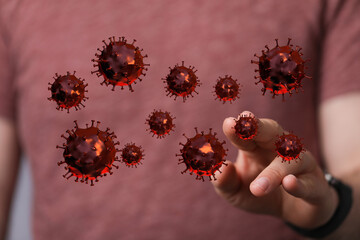 Visual representation of the coronavirus touching a human hand. Concept of the pandemic, virus spread, healthc