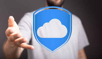 Hand offering cloud icon shield, representing secure data protection and online storage. Digital security and s