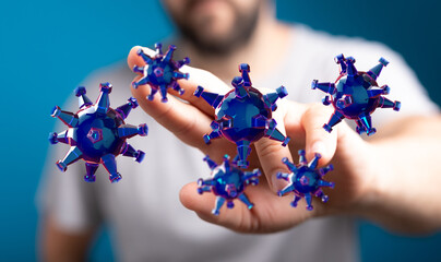 Conceptual image depicting a hand holding abstract viruses. This image evokes feelings of fear, illness, and t