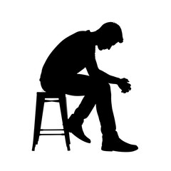 Silhouette of a Man Sitting on a Stool with Head Down.