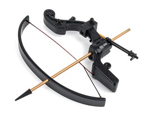 Black plastic toy crossbow with an arrow resting on it, angled view, on white