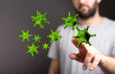 Conceptual image of a man interacting with floating green virus particles, symbolizing healthcare, disease, an