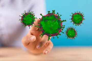Conceptual image of a hand touching floating virus particles representing digital viruses and health concerns.