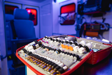Close-up of ampoules with medication in ambulance car of emergency medical service.