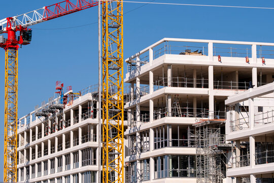 Wide balconies at construction site with tower crane mast and building development showing architecture urban engineering infrastructure property project