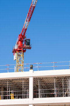 Wide tower crane mechanism at construction site and building development showing architecture urban engineering infrastructure property project