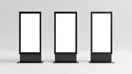 Three sleek black LCD display screens on stands for advertising