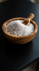 Wooden Bowl of Coarse Salt with Wooden Scoop.