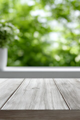 A wooden table with a white windowsill and blurred leafy green background.