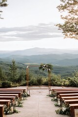 Elegant Minimalist Wedding Arch with Floral Decor Over Scenic Mountain Landscape